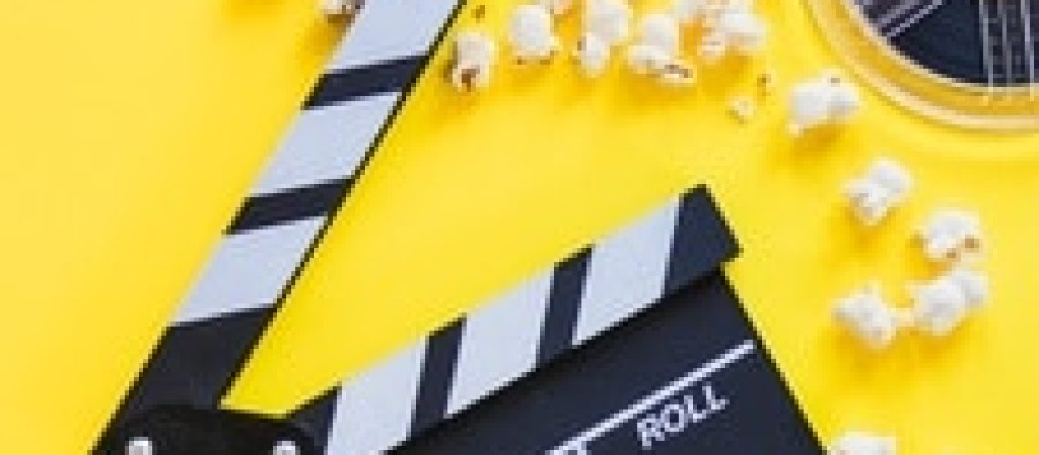 clapperboard-with-popcorn-reels_23-2147807376